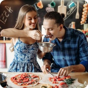 couple making pizza