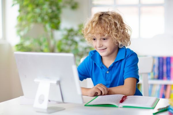 back to school boy on computer web banner