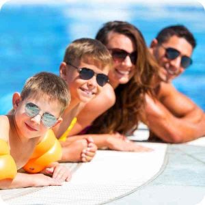 family of four in a swimming pool